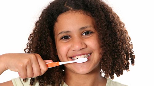Photo of a child brushing their teeth