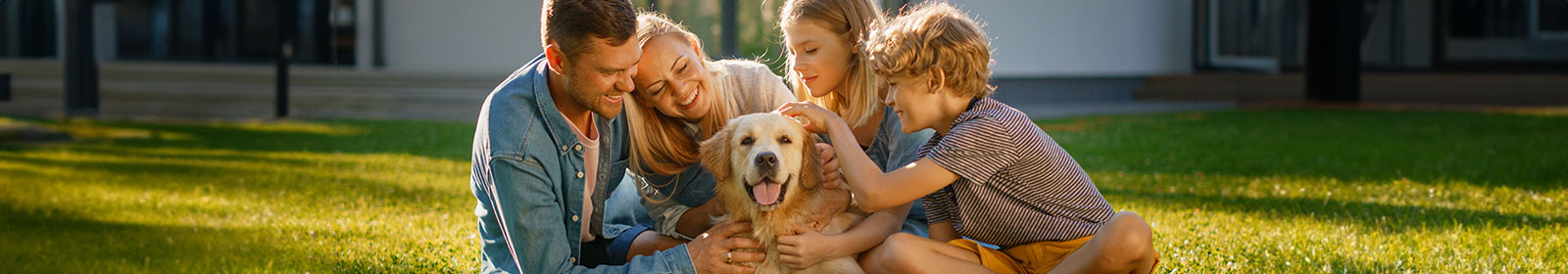 Photo of a family with their dog