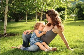 mother breastfeeding outdoors