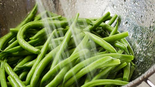 Photo of green beans being washed