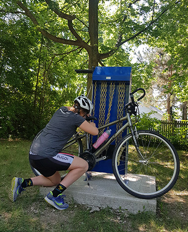 Photo of a cyclist using the CWATS repair station