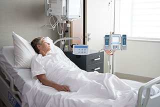 Photo of woman in hospital bed