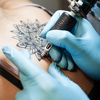 Photo of a person getting a tattoo
