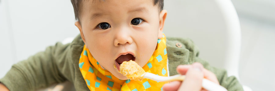 image of baby being feed