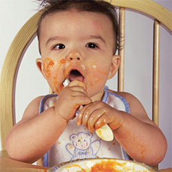 Photo of infant eating