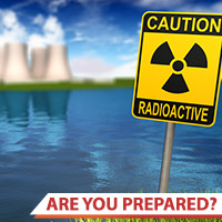 Photo of a nuclear power plant and radioactive warning sign
